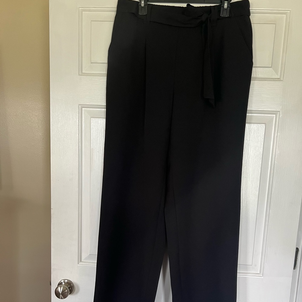 Black pull on dress pants with tie waste detail.